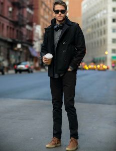 man-with-black-jeans-and-shirt-and-brown-sneakers